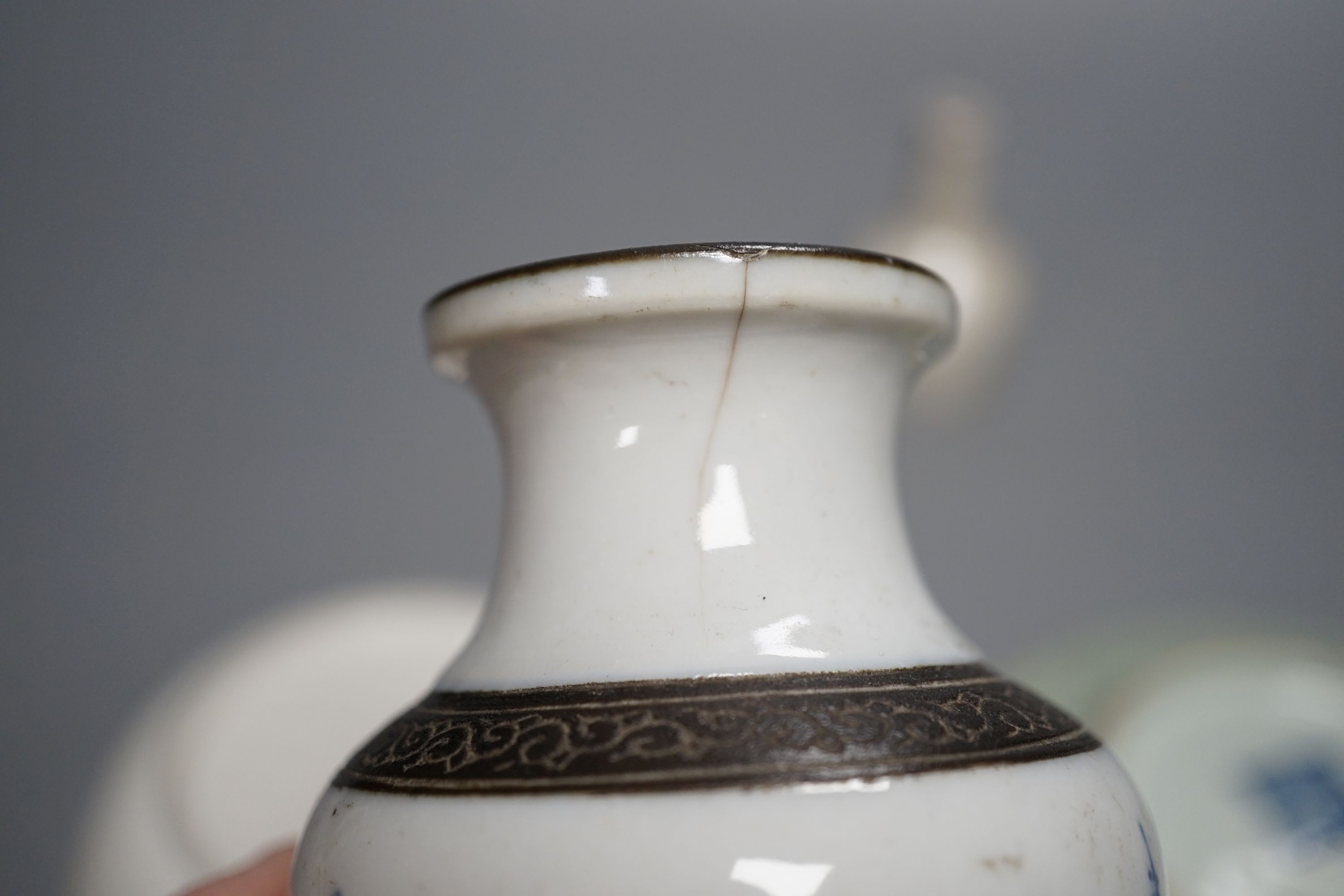 A Chinese export blue and white dish, 13cm, similar vase, a miniature crackle ware vase and a celadon saucer